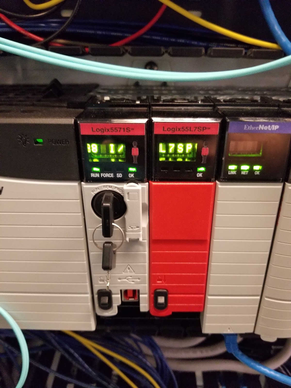 Allen-Bradley ControlLogix processor and Ethernet module inside a cabinet.