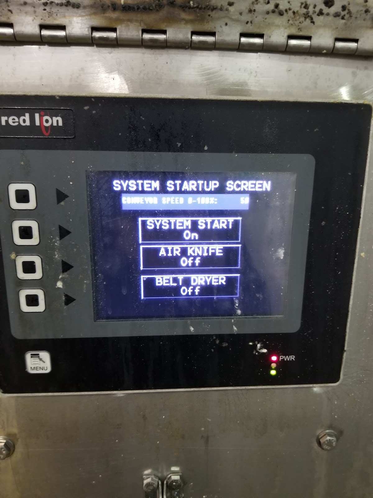 Monochrome HMI startup screen with start, stop, and belt-speed options.