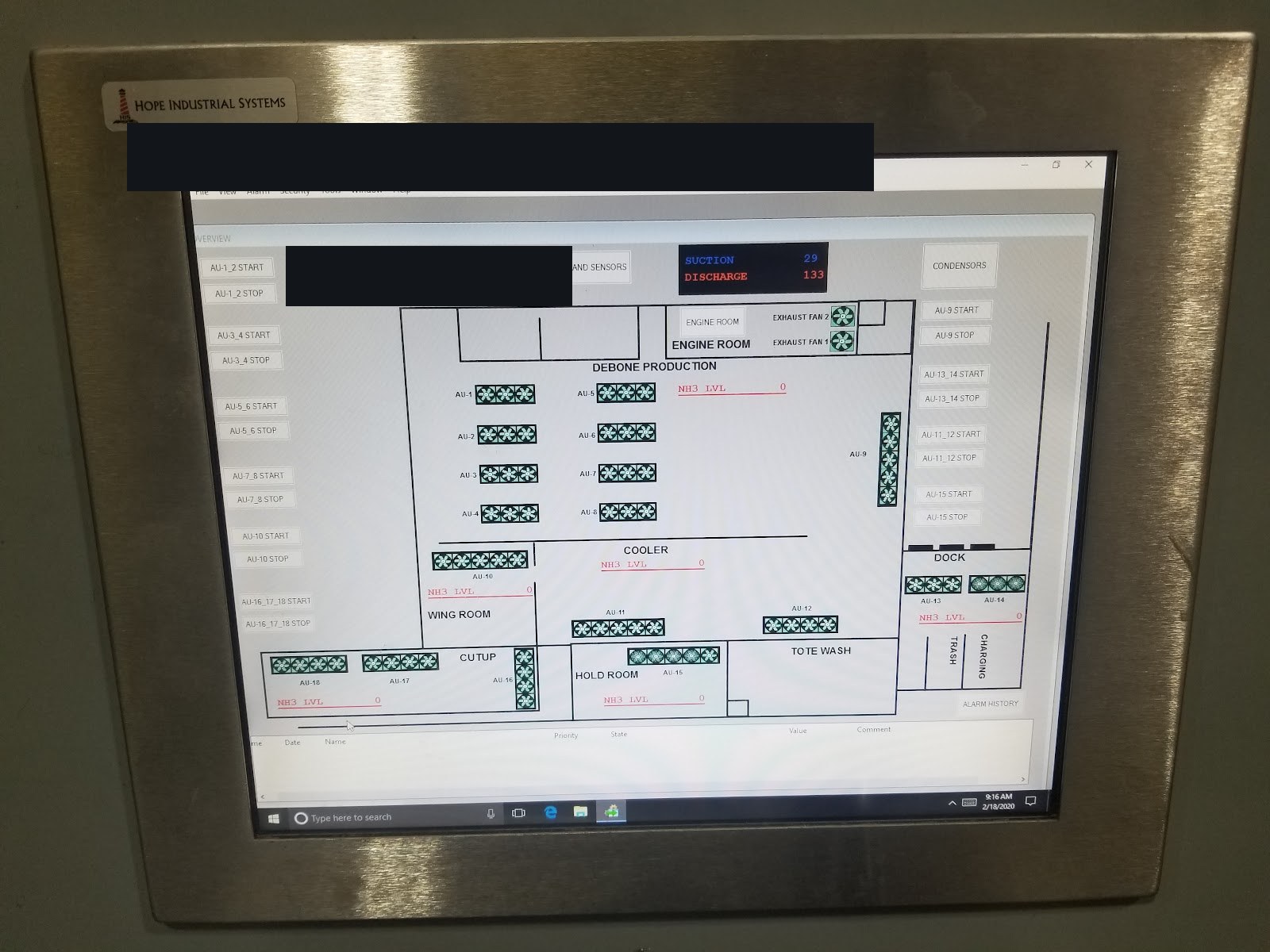 HMI in a stainless bezel showing a process overview.