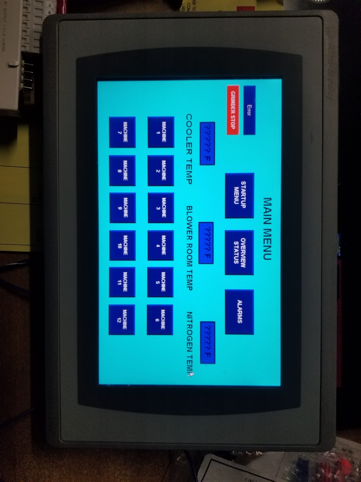 Vertical HMI menu of control buttons on a blue background.