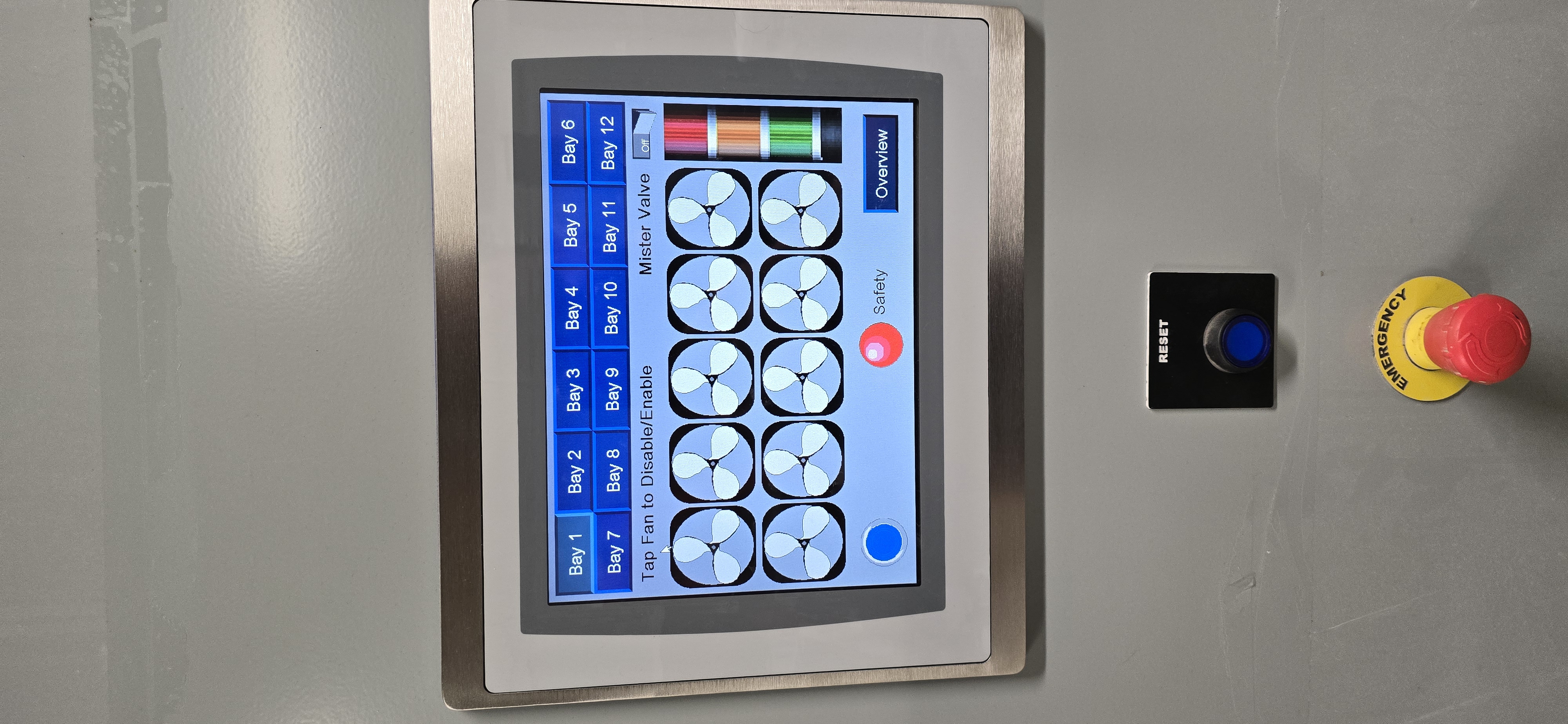 Operator station with HMI, Reset, and emergency stop.